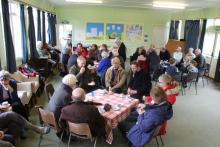 Eating hot cross buns together in the hall Eating hot cross buns together in the hall